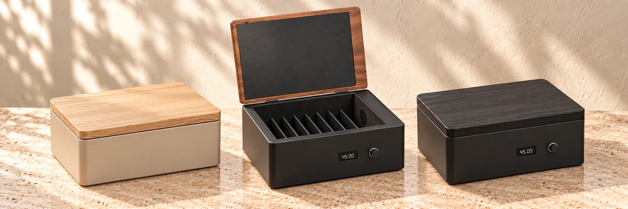 Three Presence Box finishes: closed oak and sand Core, open walnut and graphite Pro with eight slots, and closed black ash Pro